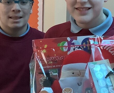 Noah receiving the prize from class 27